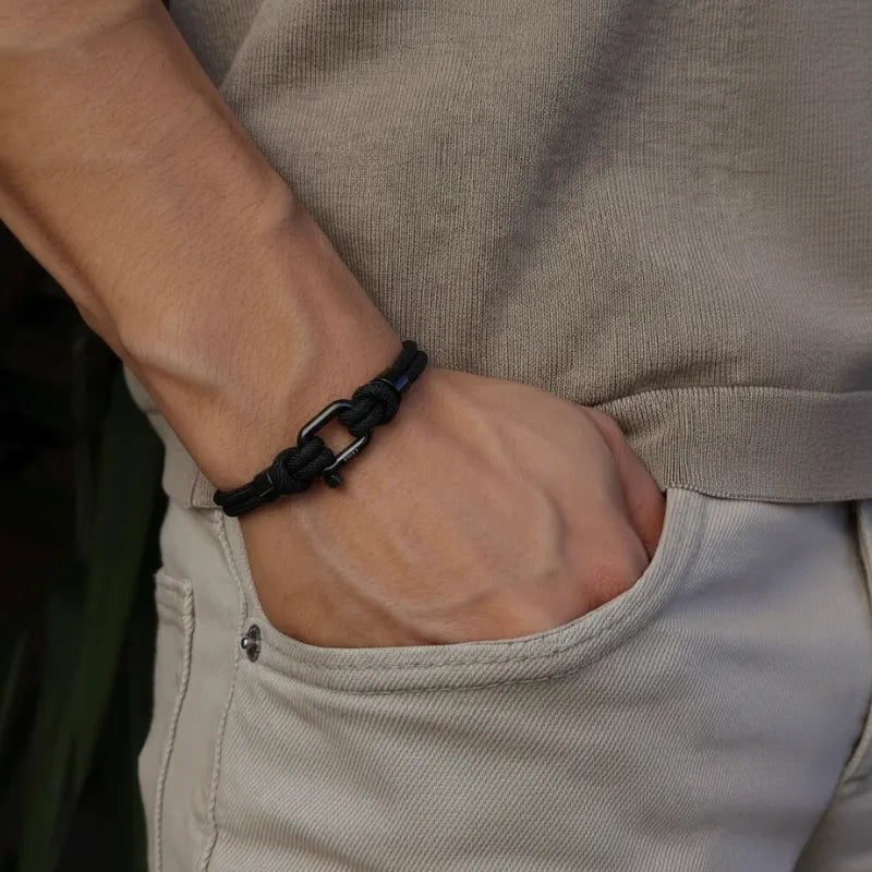 Textured view of the recycled black nylon cord of the bracelet, highlighting sustainable material